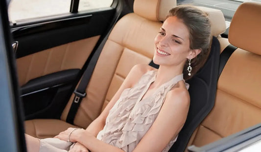 Post-workout recovery with a heated massage cushion in car seat